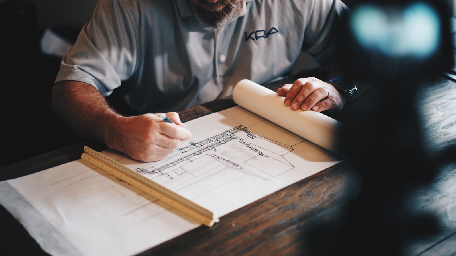 Certifier reviewing building plans before a sale