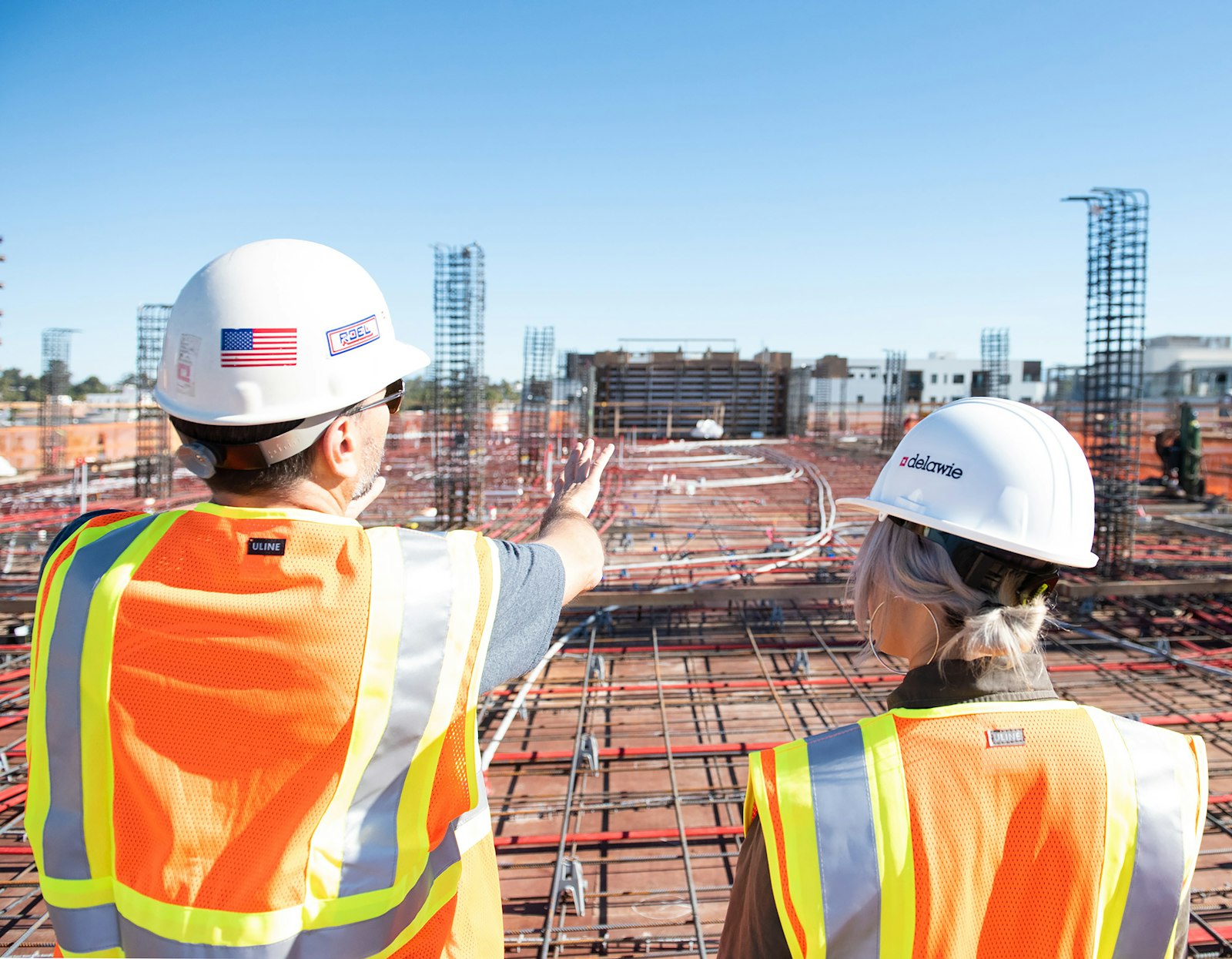 Certifiers inspecting a concrete slab on site